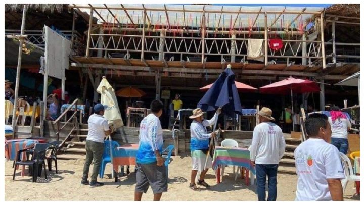 Turistas denuncian cobros excesivos en playa de Huatulco; autoridades sancionan a restauranteros